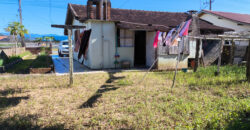 Casa localizada no Alto Arroio, em frente a marginal da BR-101